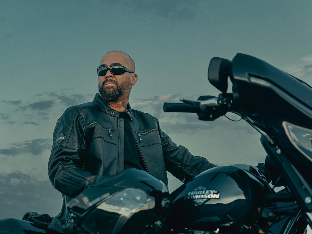2025-man-leather-jacket-near-bike